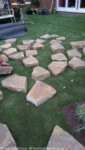 building the fire pit, drystone wall fire pit