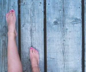 walking barefoot on wood decking, original image by freemixer on getty images signature